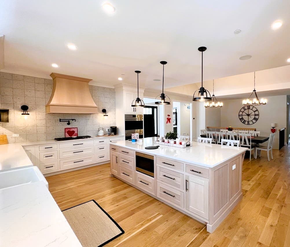 Farmhouse-style kitchen with a large island and warm wood floors
